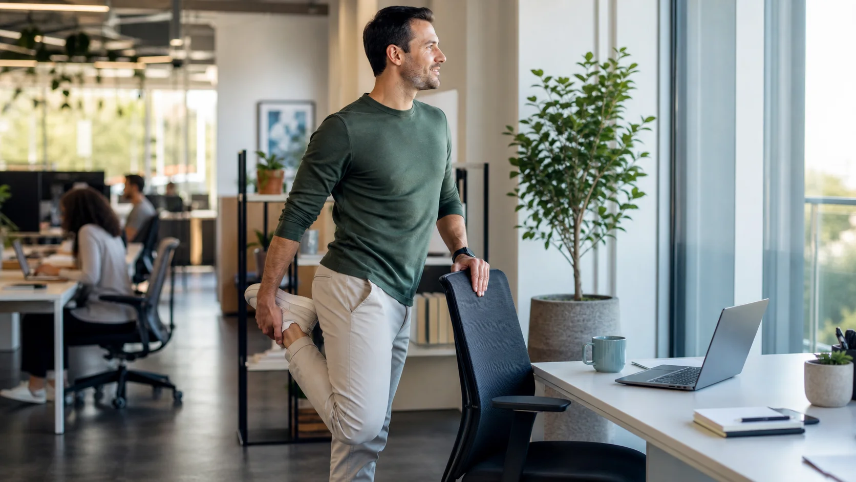Office worker standing up from a desk chair and stretching